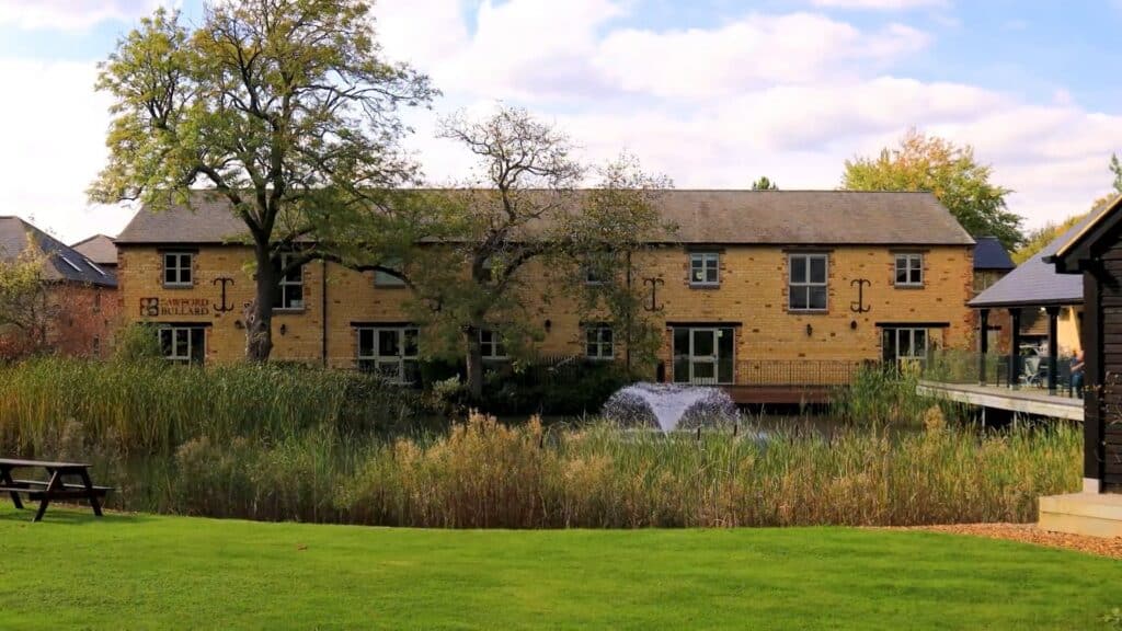 Scenic view of Blisworth village with historic buildings and lush greenery.